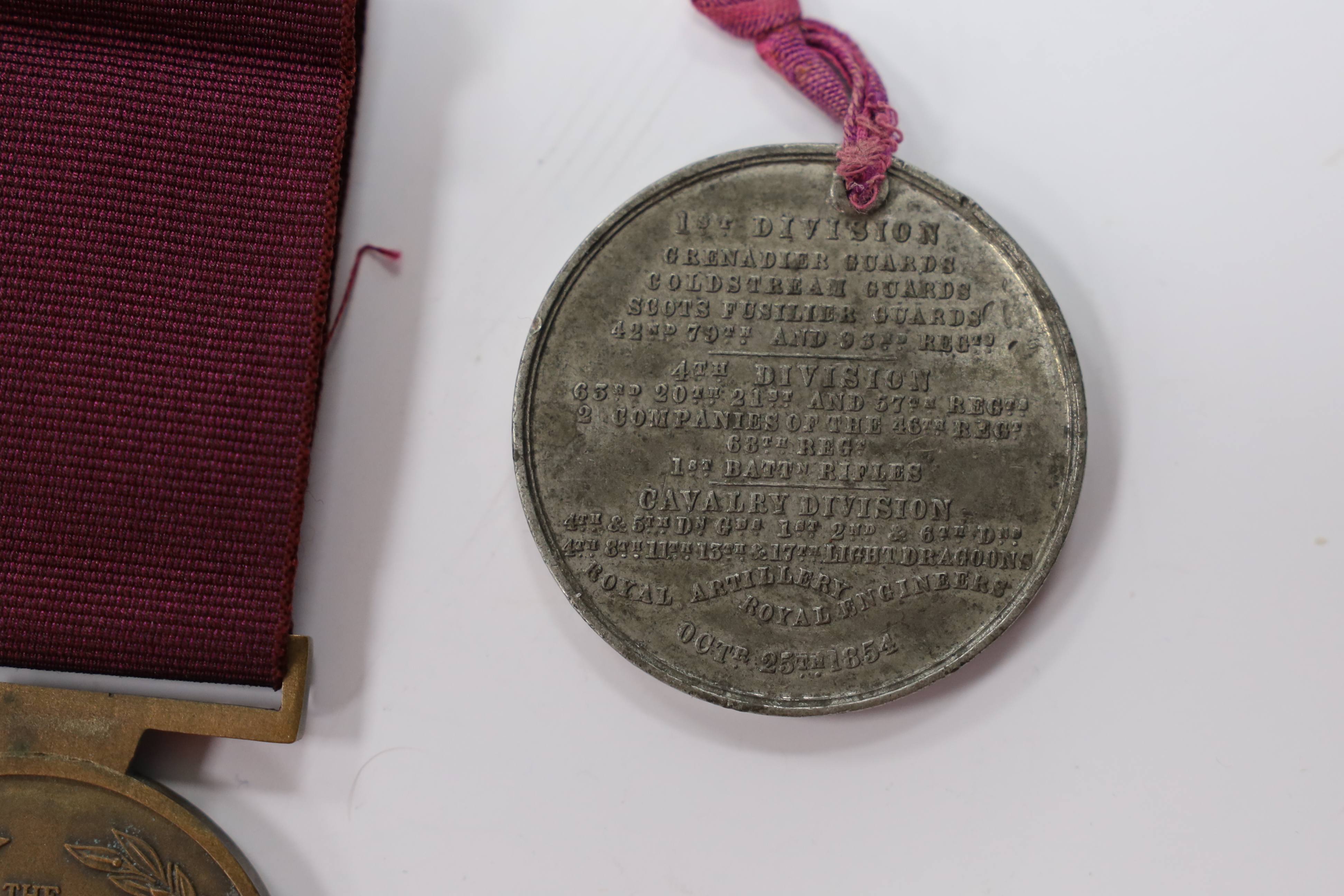 Assorted medals; two replica British North Borneo medals; Balaklava medallion; bronze GV medal; German China Campaign medal; bronze NRA medallion, unnamed